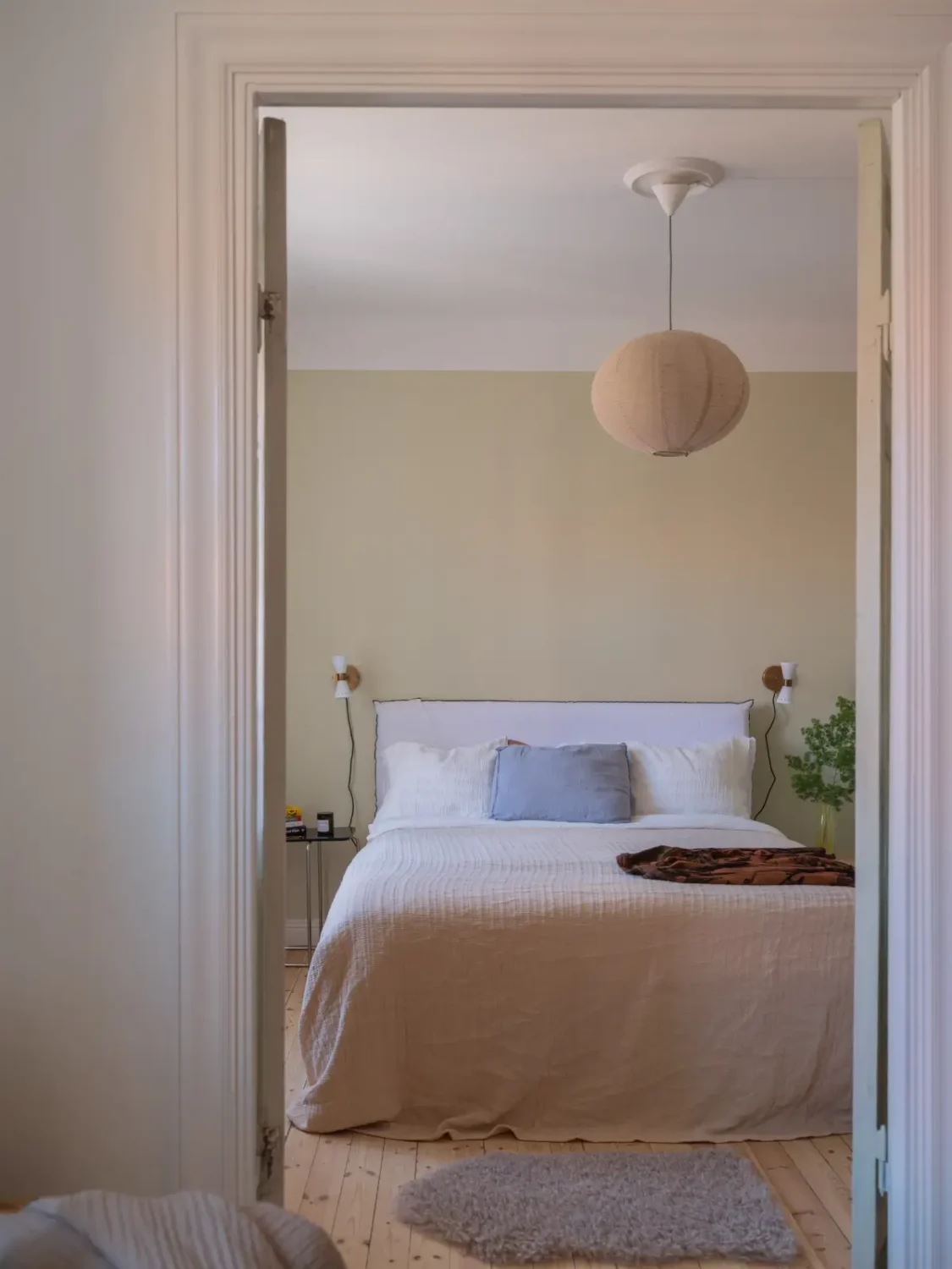A Bright Apartment Where Historic Character Meets Contemporary Design 12 view into bedroom