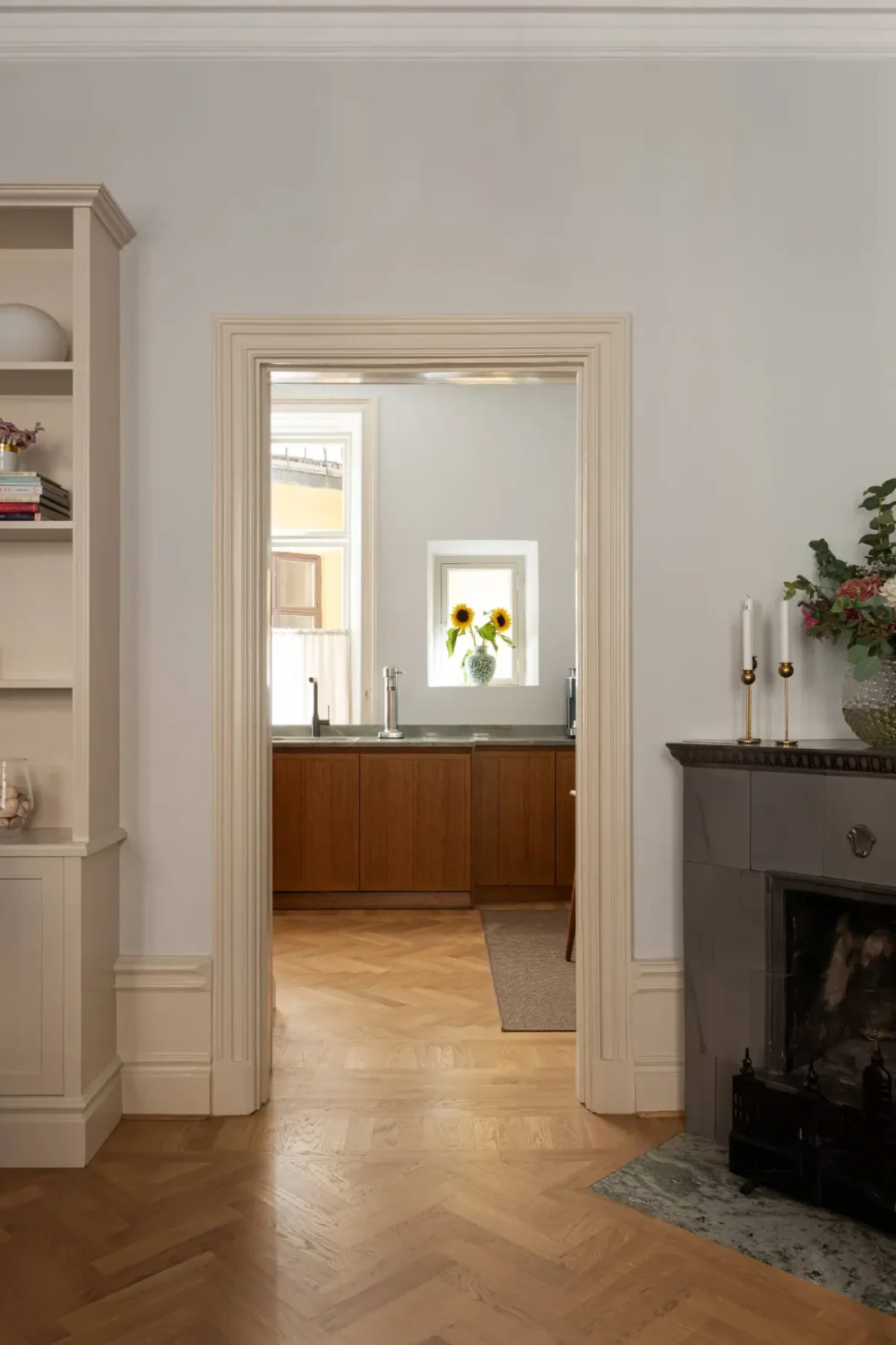 A Luxurious Family Apartment with a Dramatic Black Bathroom 6 view into kitchen