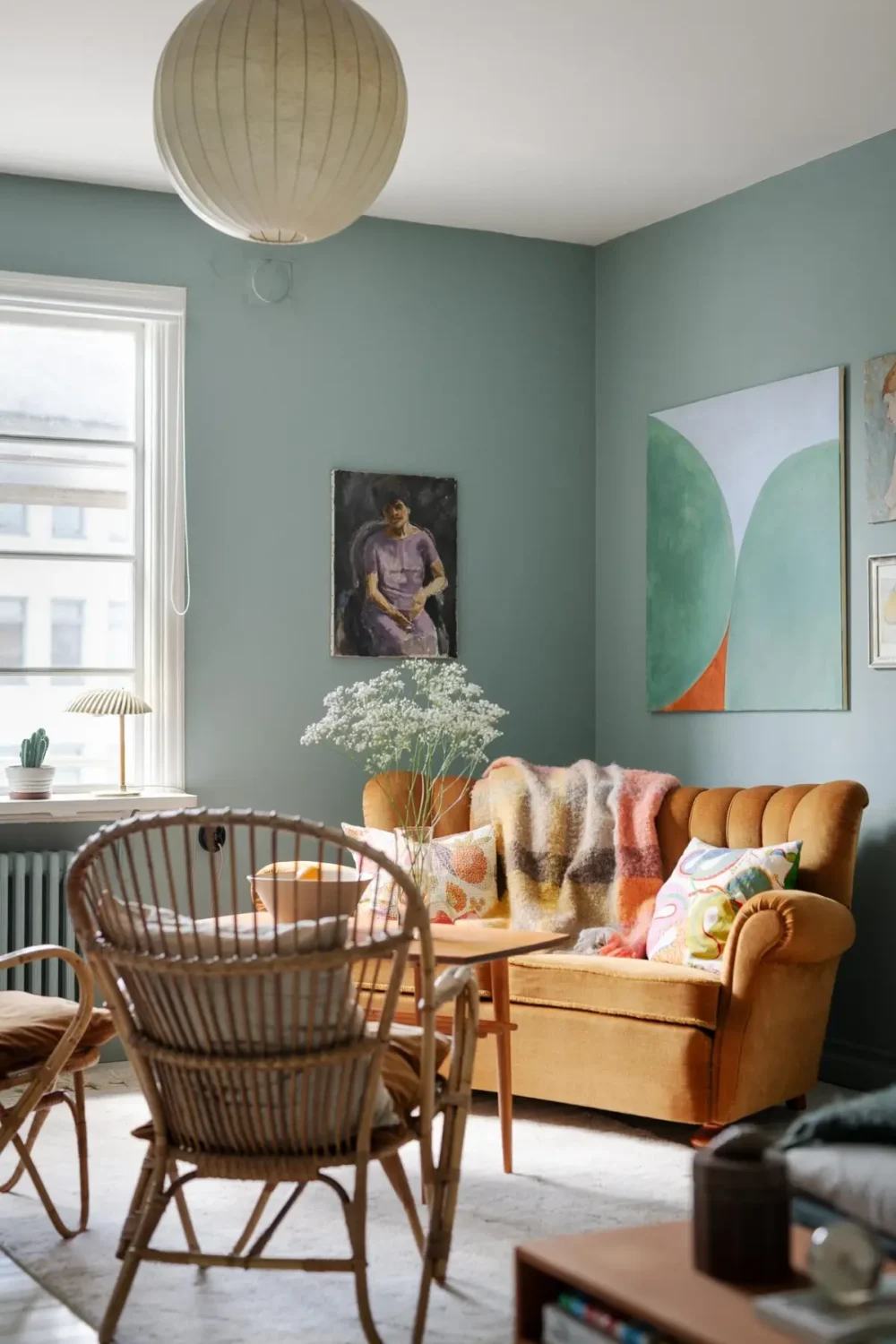 Historic Character and Color in a Swedish Studio Apartment 6 vintage ochre sofa rattan chairs