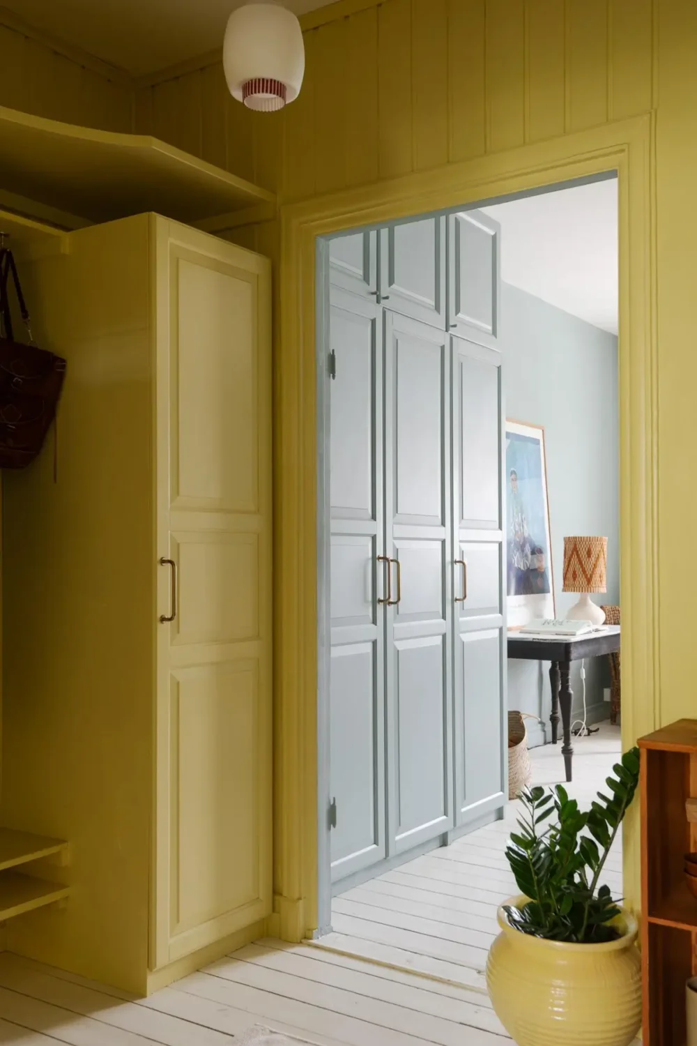 Historic Character and Color in a Swedish Studio Apartment 12 yellow hall view into main room