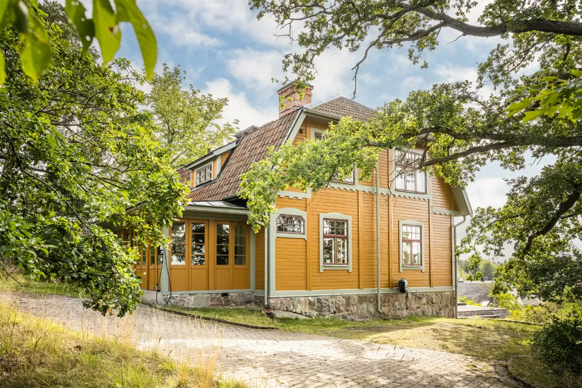 A Cozy Early 20th-Century Home with Views of Lake Mälaren in Sweden 1 yellow historic swedish villa