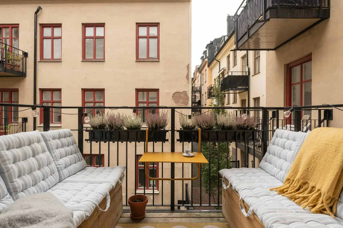 A Stylish Beige Apartment with a Light Blue Kitchen 18 balcony two benches