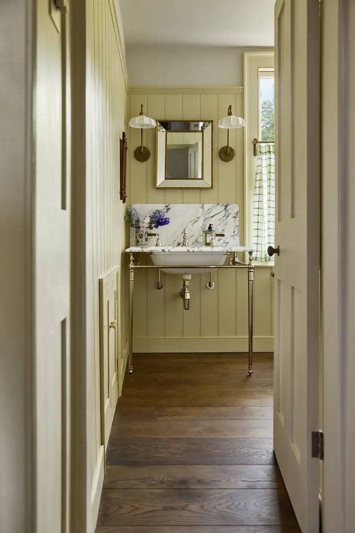 A deVOL Kitchen in a Beautiful Restored Georgian Townhouse in London 20 bathroom butter-yellow paneling marble sink