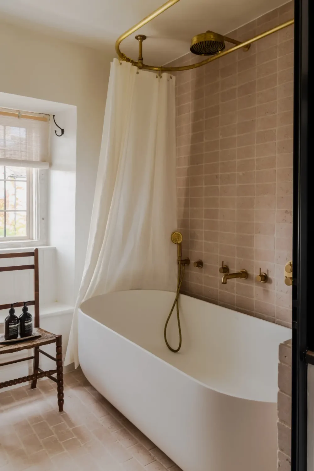 The Color Trends for 2026: A Return to Nature, Balance, and Grounding 23 bathroom-stone-wall-freestanding-bath-brass-fittings-nordroom