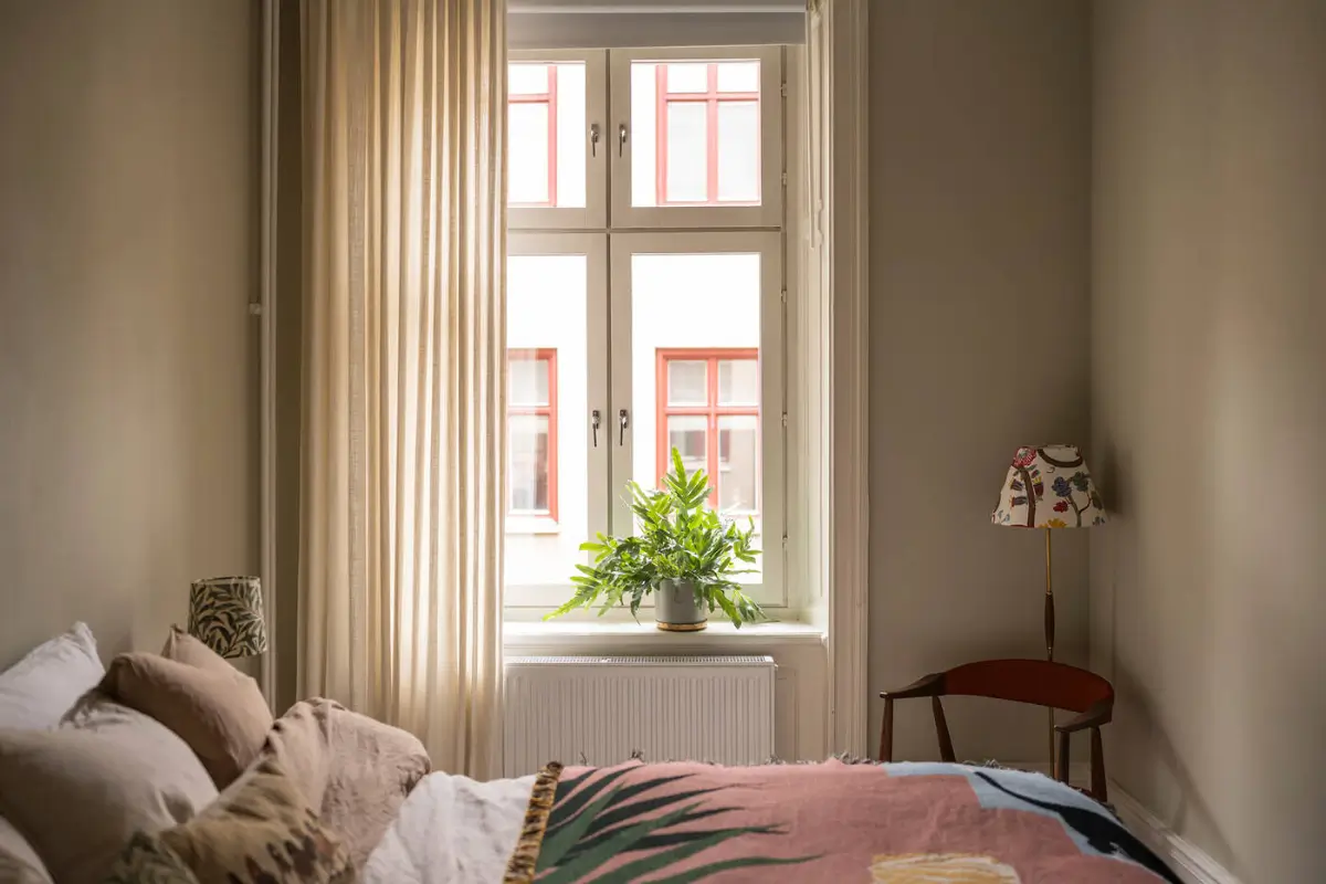 A Stylish Beige Apartment with a Light Blue Kitchen 24 bedroom colorful throw