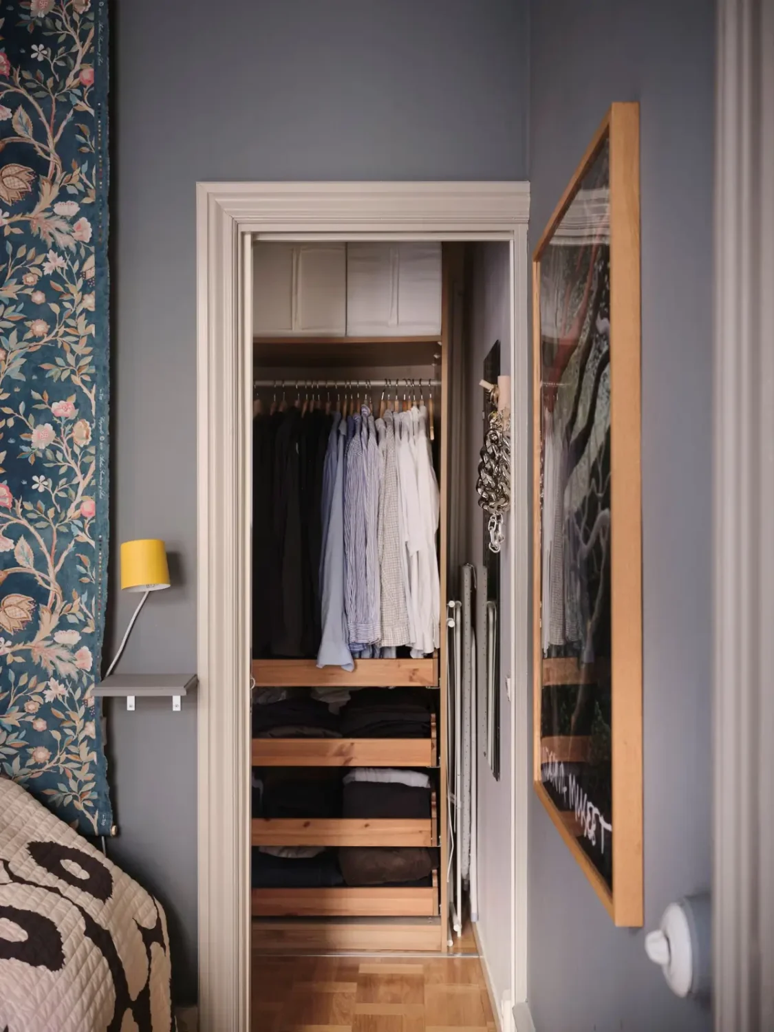 Color, Books, and a Walk-In Wardrobe in a Small Stockholm Apartment 21 bedroom walk-in wardrobe
