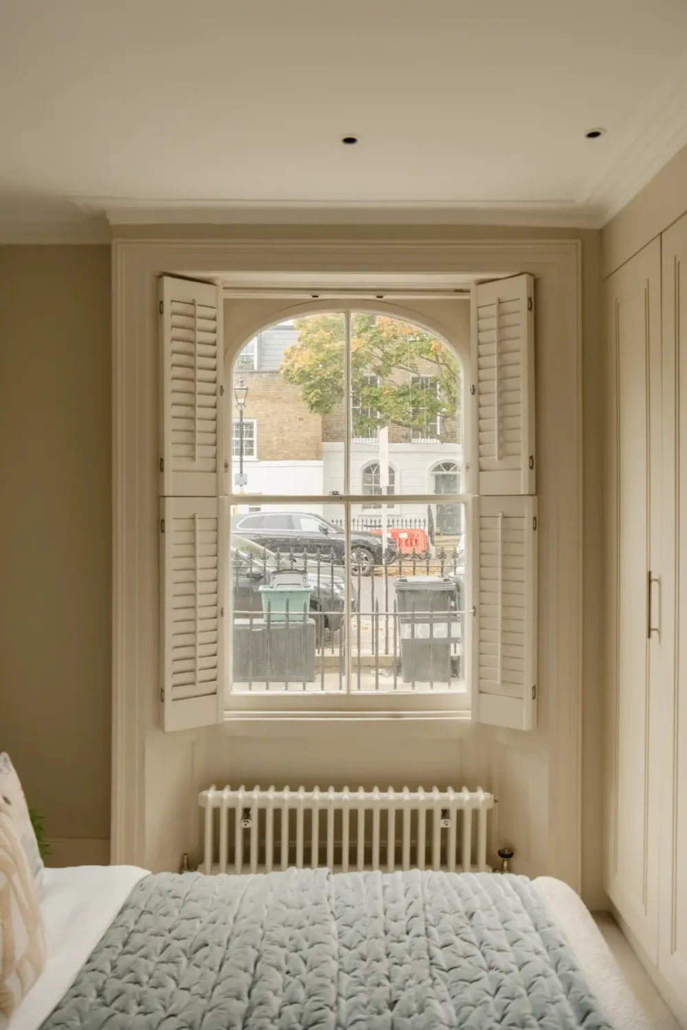 A Serene Duplex Apartment with a Glass Extension in London 23 bedroom window with shutters
