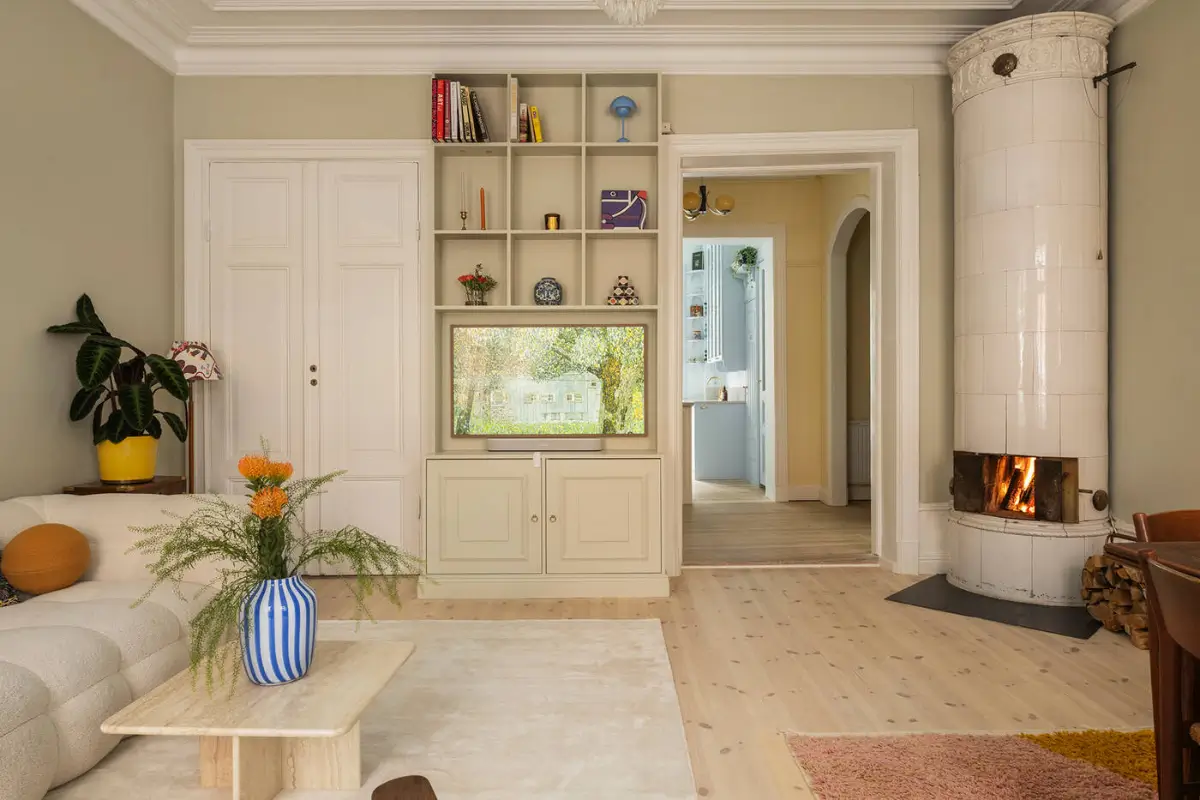 A Stylish Beige Apartment with a Light Blue Kitchen 7 beige living room fireplace built-in cabinets