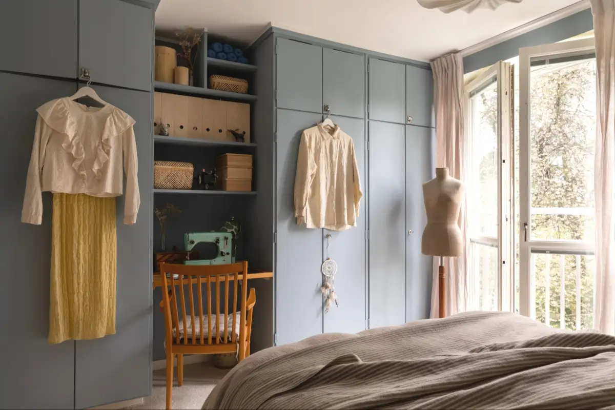 A Well-Preserved 1950s Apartment North of Stockholm 23 blue bedroom built-in wardrobes with desk