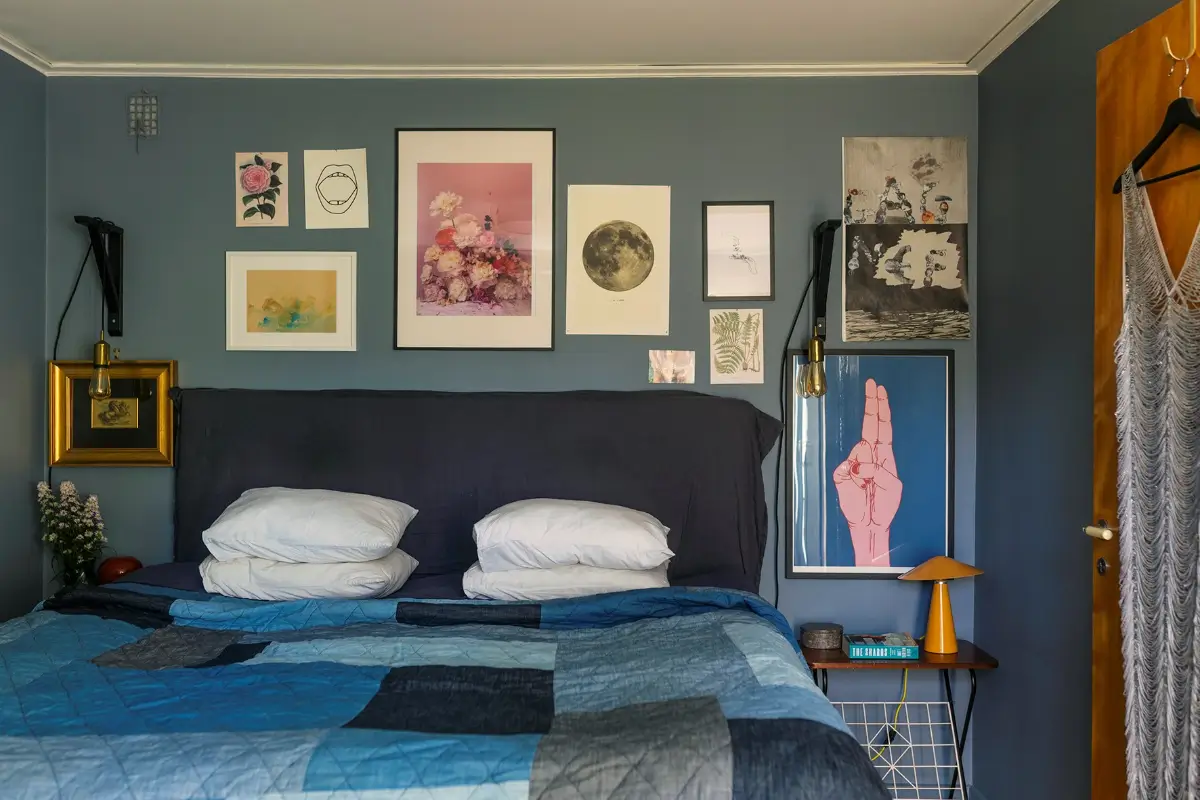 A Charming 1960s Family Home in Stockholm 24 blue bedroom gallery wall