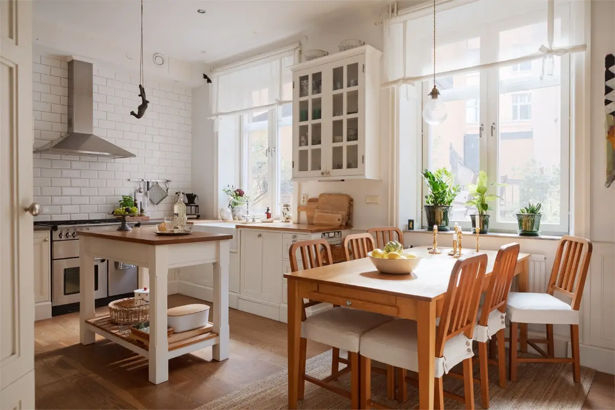 A Light-Filled Stockholm Apartment with a Charming Kitchen 6 classic white kitchen with island