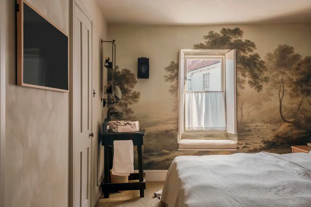 Lime Paint and Cozy Rooms in a Charming English Cottage 14 cottage bedroom with wall coverings and marble sink