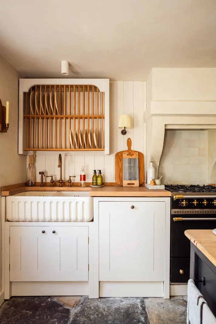 Lime Paint and Cozy Rooms in a Charming English Cottage 4 cottage kitchen butler sink stone floor