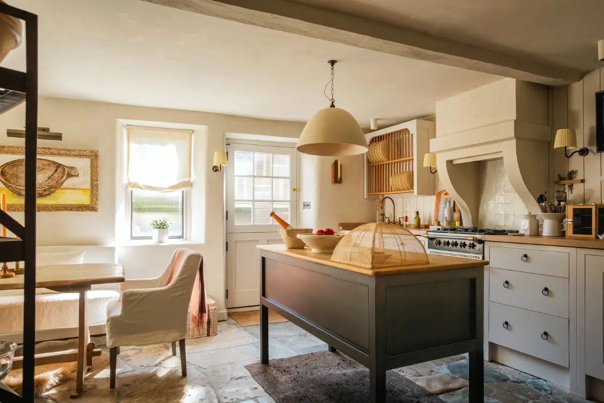 cottage kitchen with island and stone floor