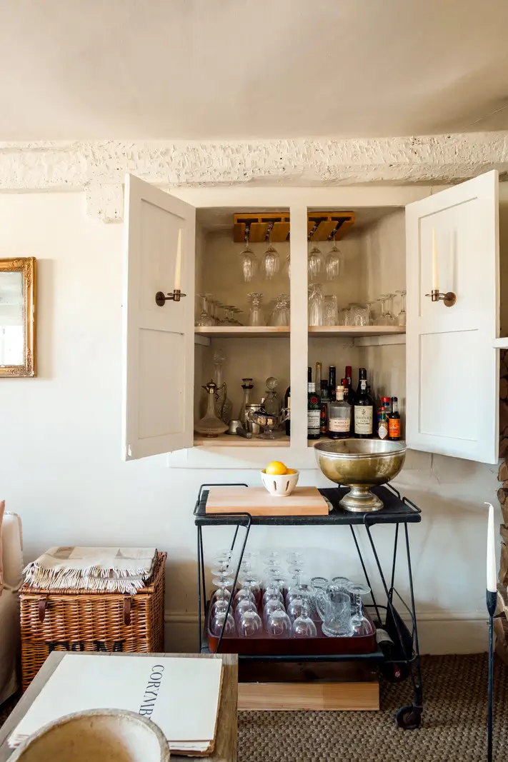 Lime Paint and Cozy Rooms in a Charming English Cottage 11 cottage living room wine cabinet