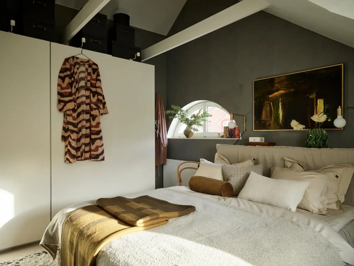 Gray Tones and High Ceilings in a Cozy Swedish Duplex Apartment 14 cozy bedroom exposed beams dark gray wallpaper white wardrobes