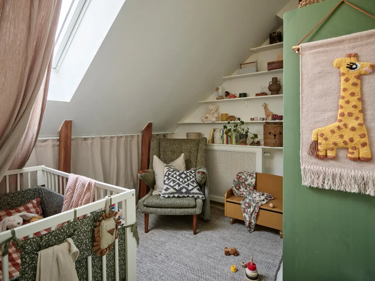 Gray Tones and High Ceilings in a Cozy Swedish Duplex Apartment 19 cozy nursery slanted ceiling shelves