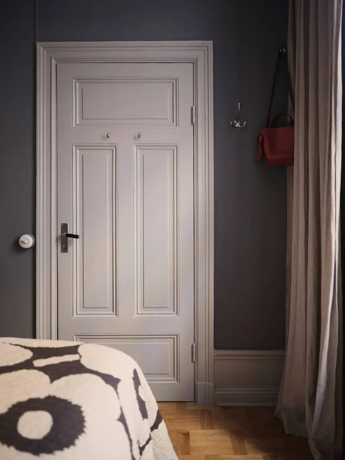 Color, Books, and a Walk-In Wardrobe in a Small Stockholm Apartment 23 dark blue bedroom