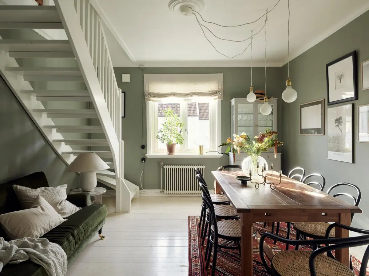Gray Tones and High Ceilings in a Cozy Swedish Duplex Apartment 22 dining room light wooden floor gray-green walls
