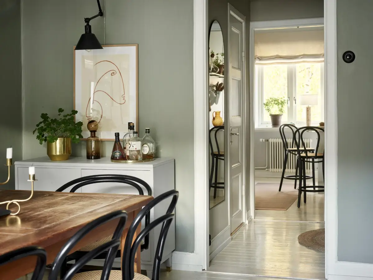 Gray Tones and High Ceilings in a Cozy Swedish Duplex Apartment 27 dining room view into kitchen