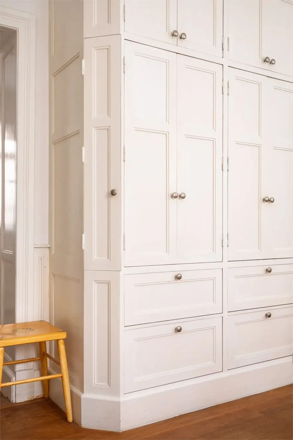 A Light-Filled Stockholm Apartment with a Charming Kitchen 10 floor-to-ceiling kitchen cabinets