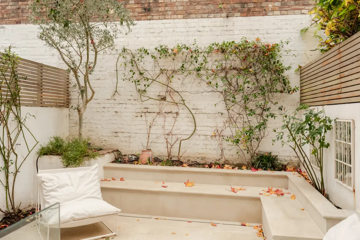 A Serene Duplex Apartment with a Glass Extension in London 15 garden built-in benches