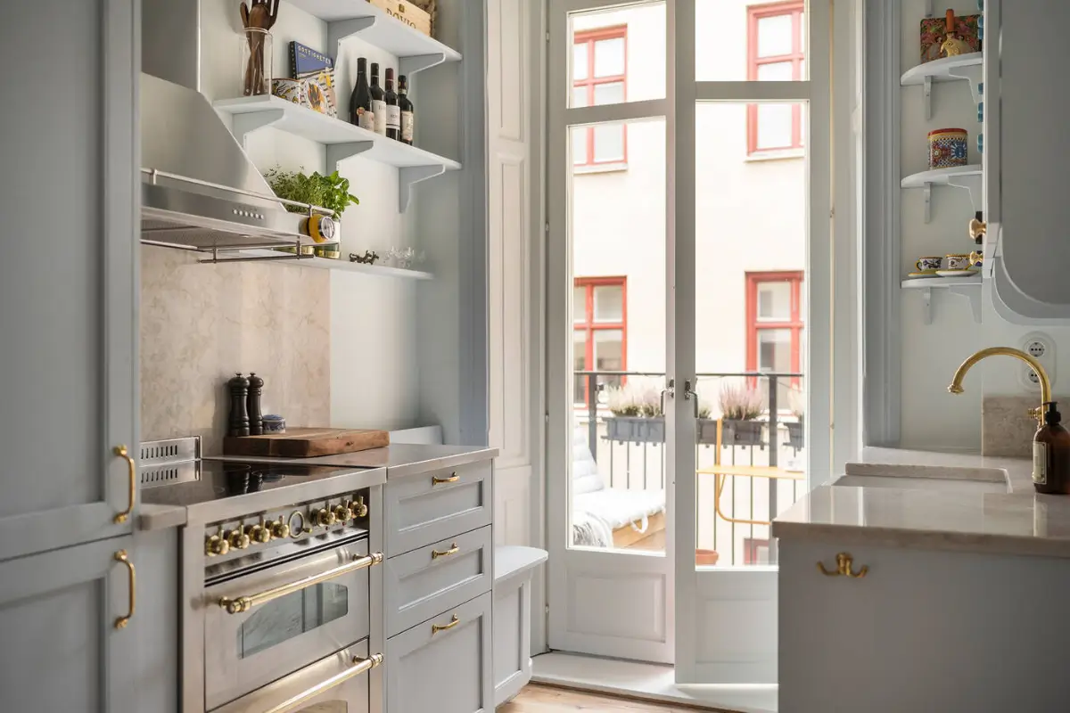 A Stylish Beige Apartment with a Light Blue Kitchen 11 glass balcony doors