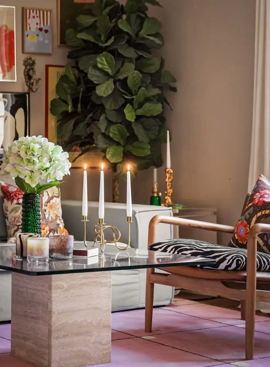 A Colorful Studio Apartment with Gucci Wallpaper 4 glass coffee table pink rug A Colorful Studio Apartment with Gucci Wallpaper