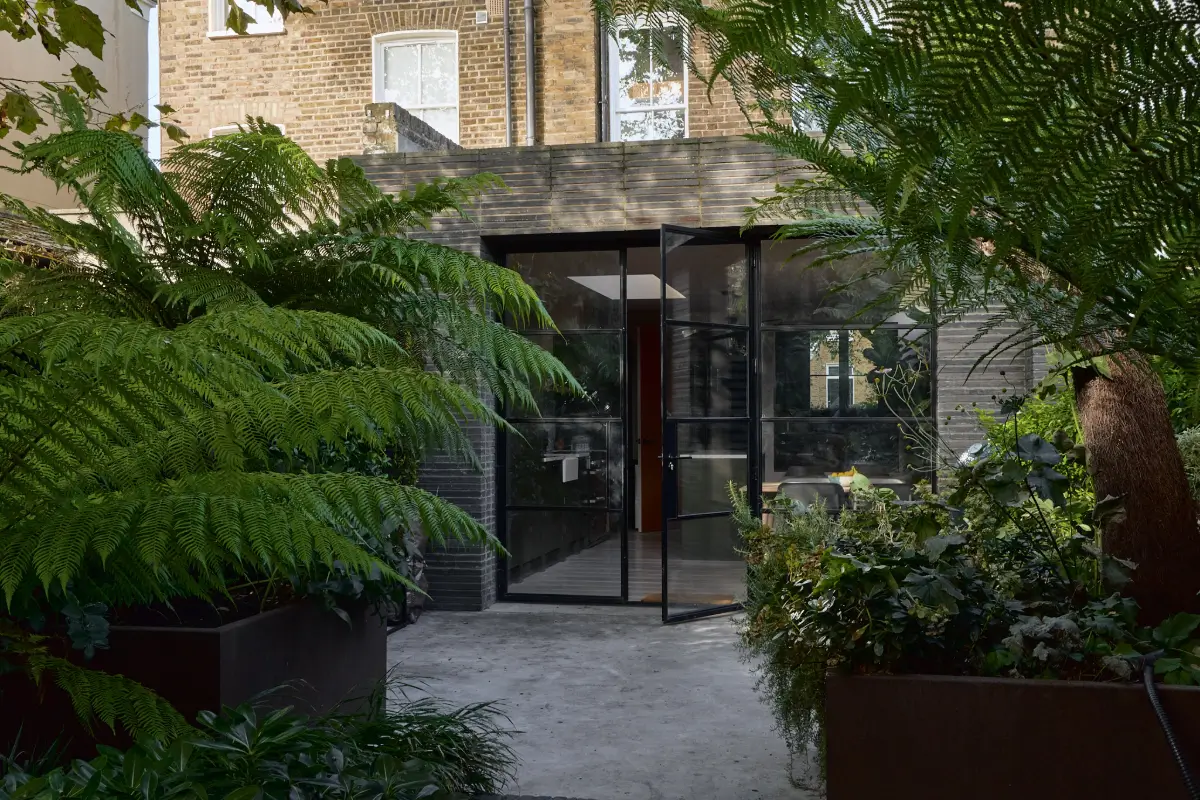 A Beautiful Victorian Townhouse Reimagined for Modern Living 24 glass garden doors