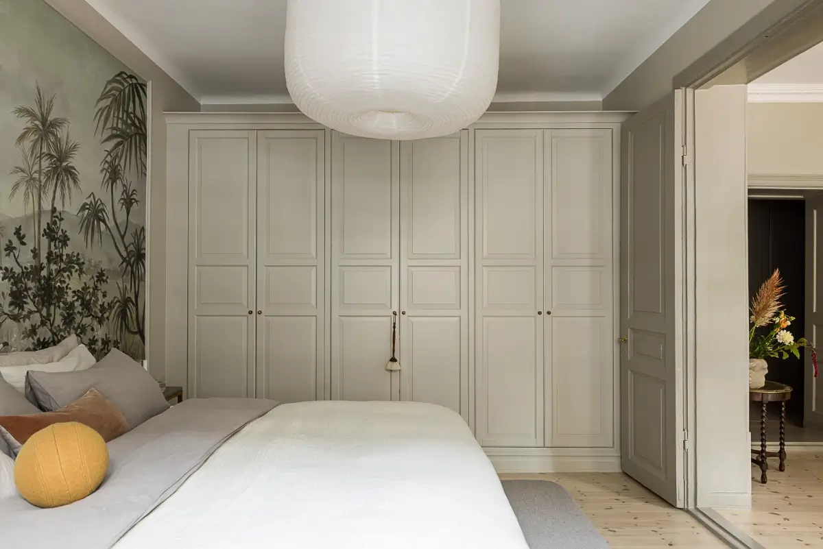 Gray Tones, Wallpapers, and a Mint Green Fireplace in a Swedish Apartment 19 gray bedroom built-in wardrobes