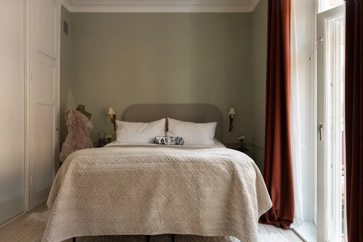 Neutral Tones and Period Character from the 1910s in a Stockholm Apartment 18 gray bedroom terracotta red curtains
