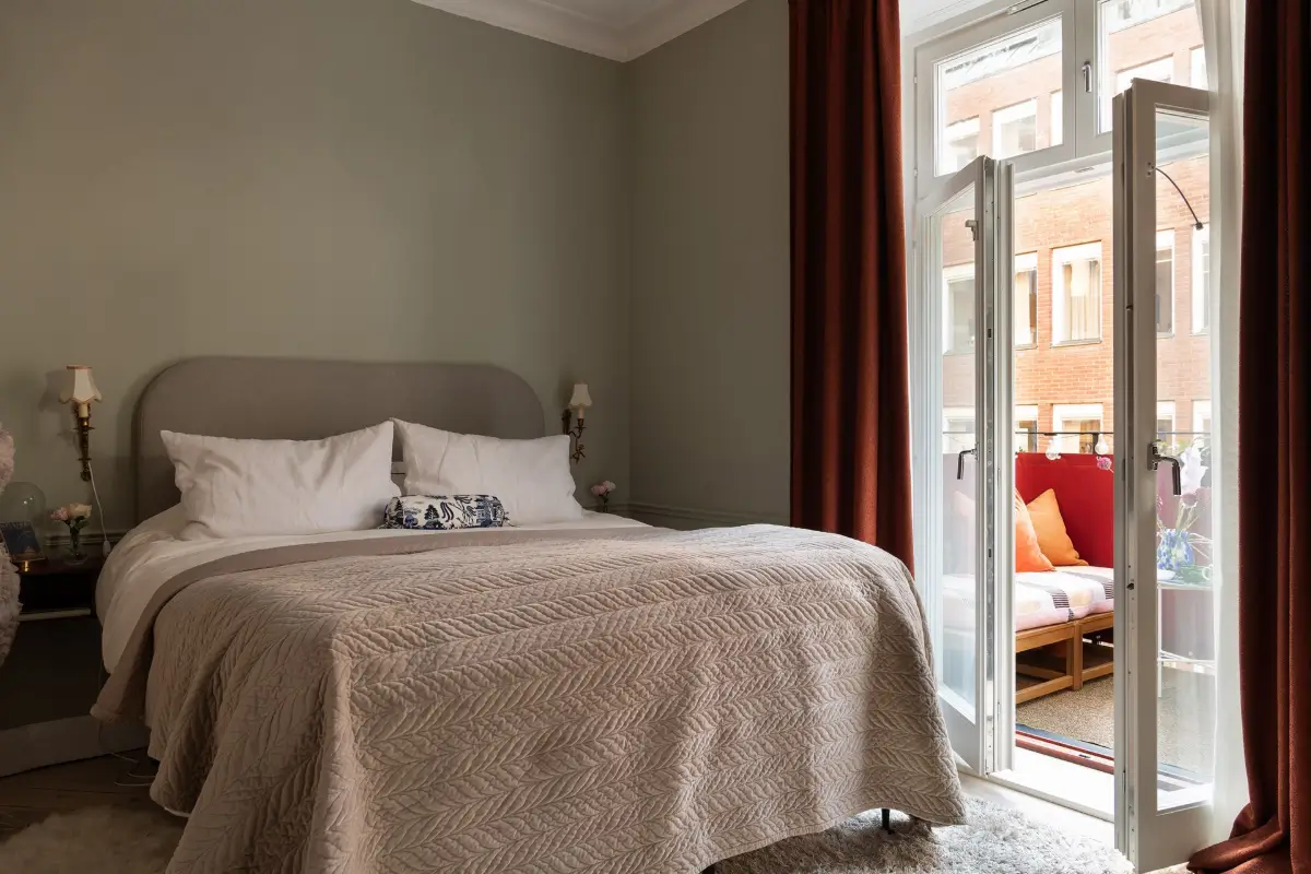 Neutral Tones and Period Character from the 1910s in a Stockholm Apartment 20 gray bedroom with balcony