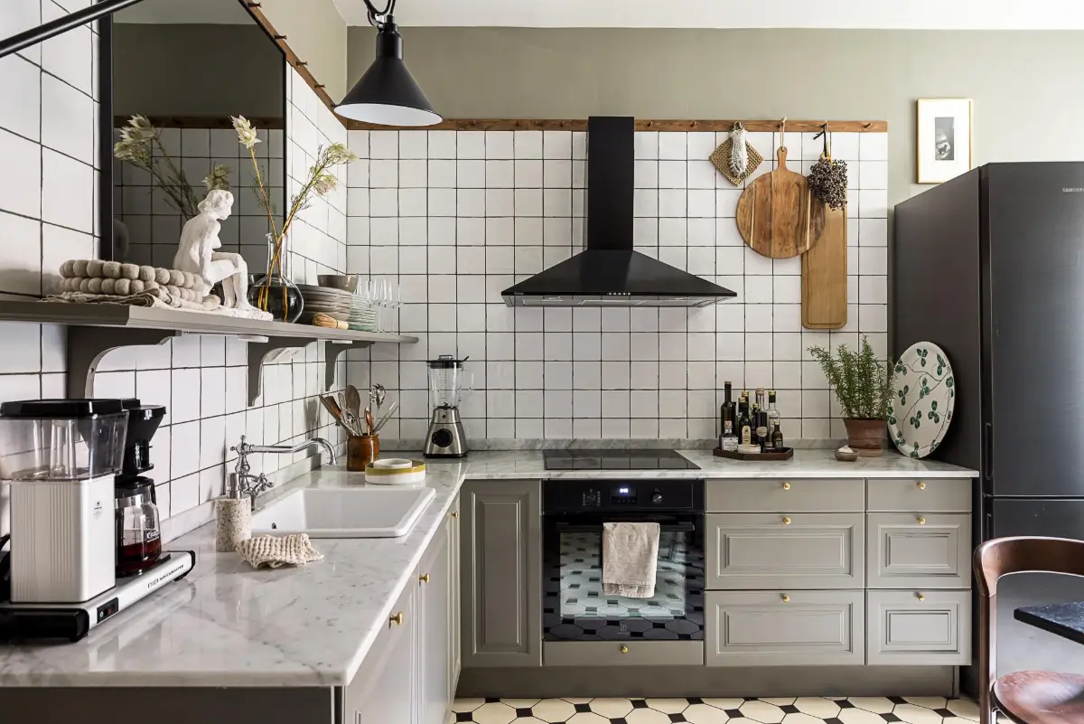 Gray Tones, Wallpapers, and a Mint Green Fireplace in a Swedish Apartment 24 gray kitchen marble countertop white backsplash tiles