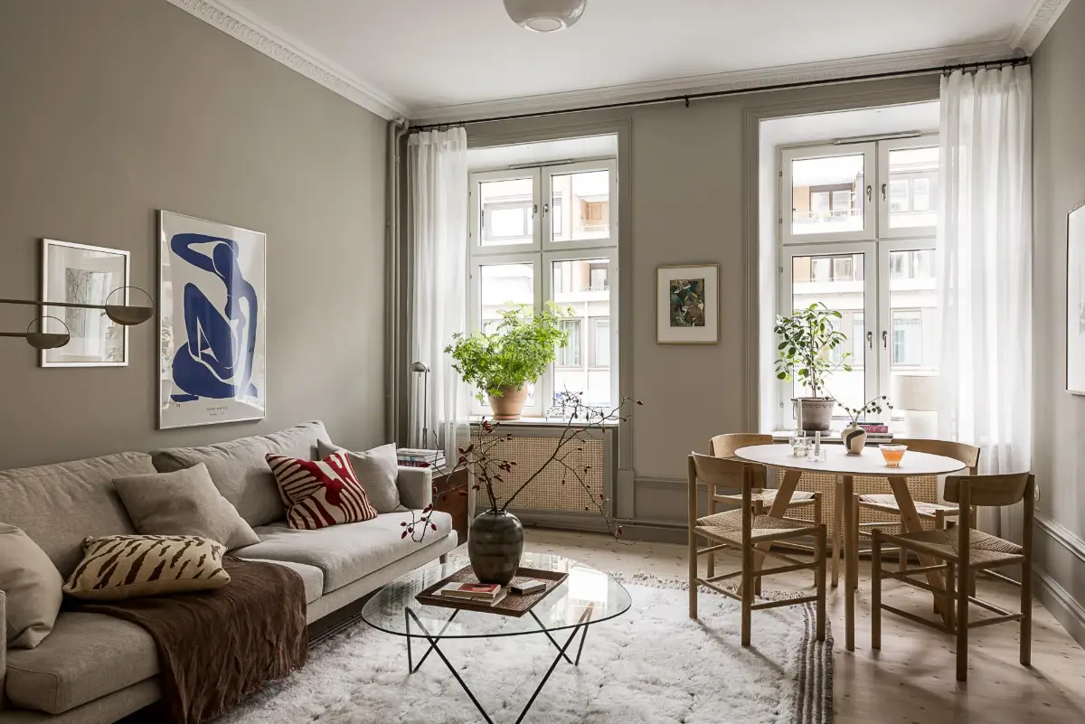 Gray Tones, Wallpapers, and a Mint Green Fireplace in a Swedish Apartment 3 gray scandinavian living room large windows