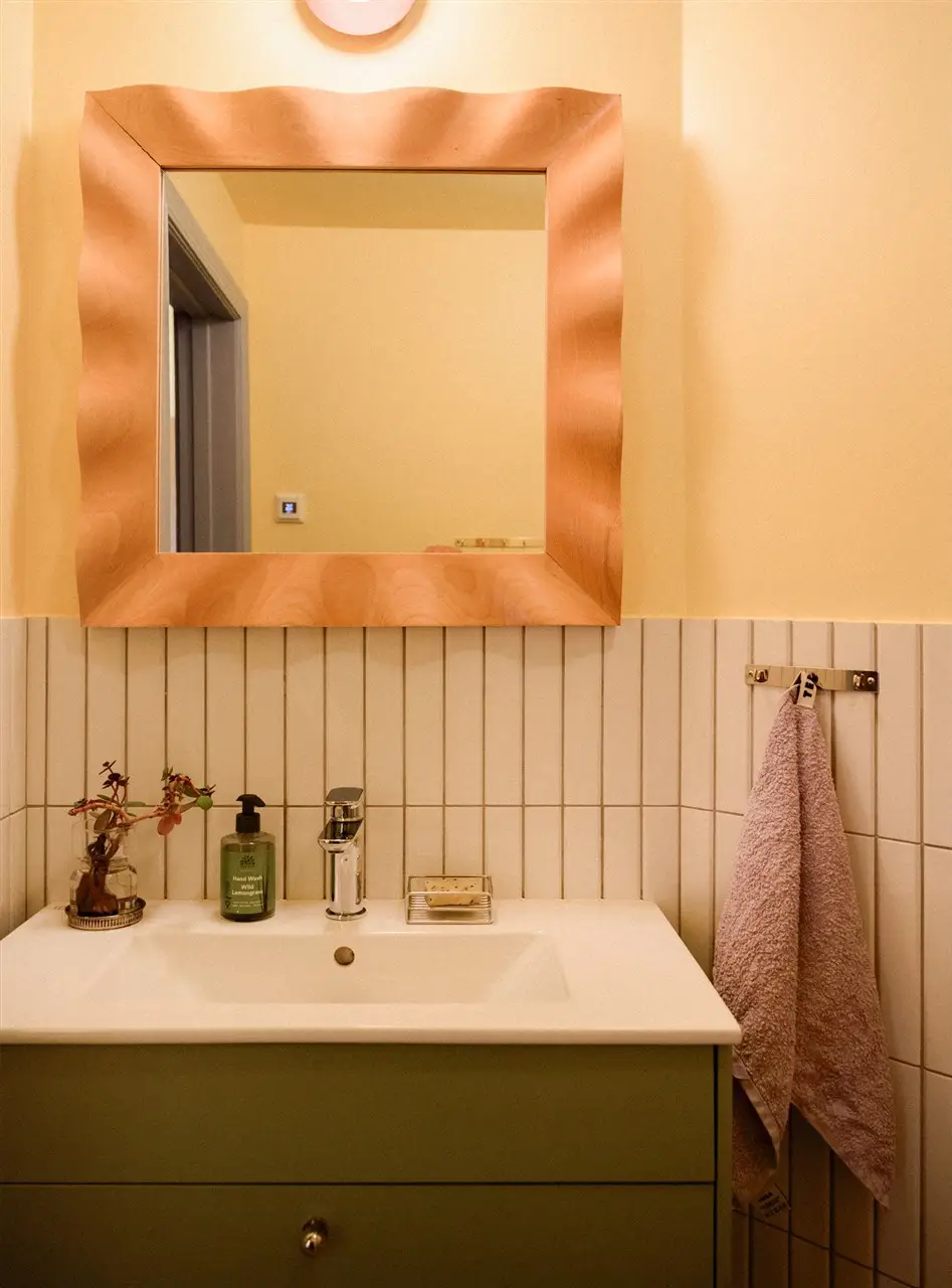 A Colorful Stockholm Family Apartment with Views of the Lake 33 green bathroom vanity