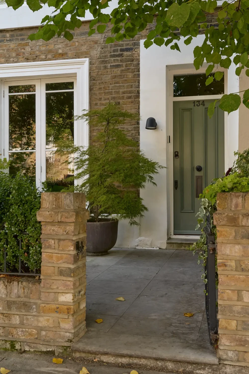 A Beautiful Victorian Townhouse Reimagined for Modern Living 45 green front door victorian townhouse london