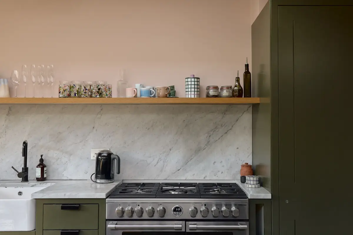 A Beautiful Victorian Townhouse Reimagined for Modern Living 13 green kitchen cabinets marble countertop wooden shelf