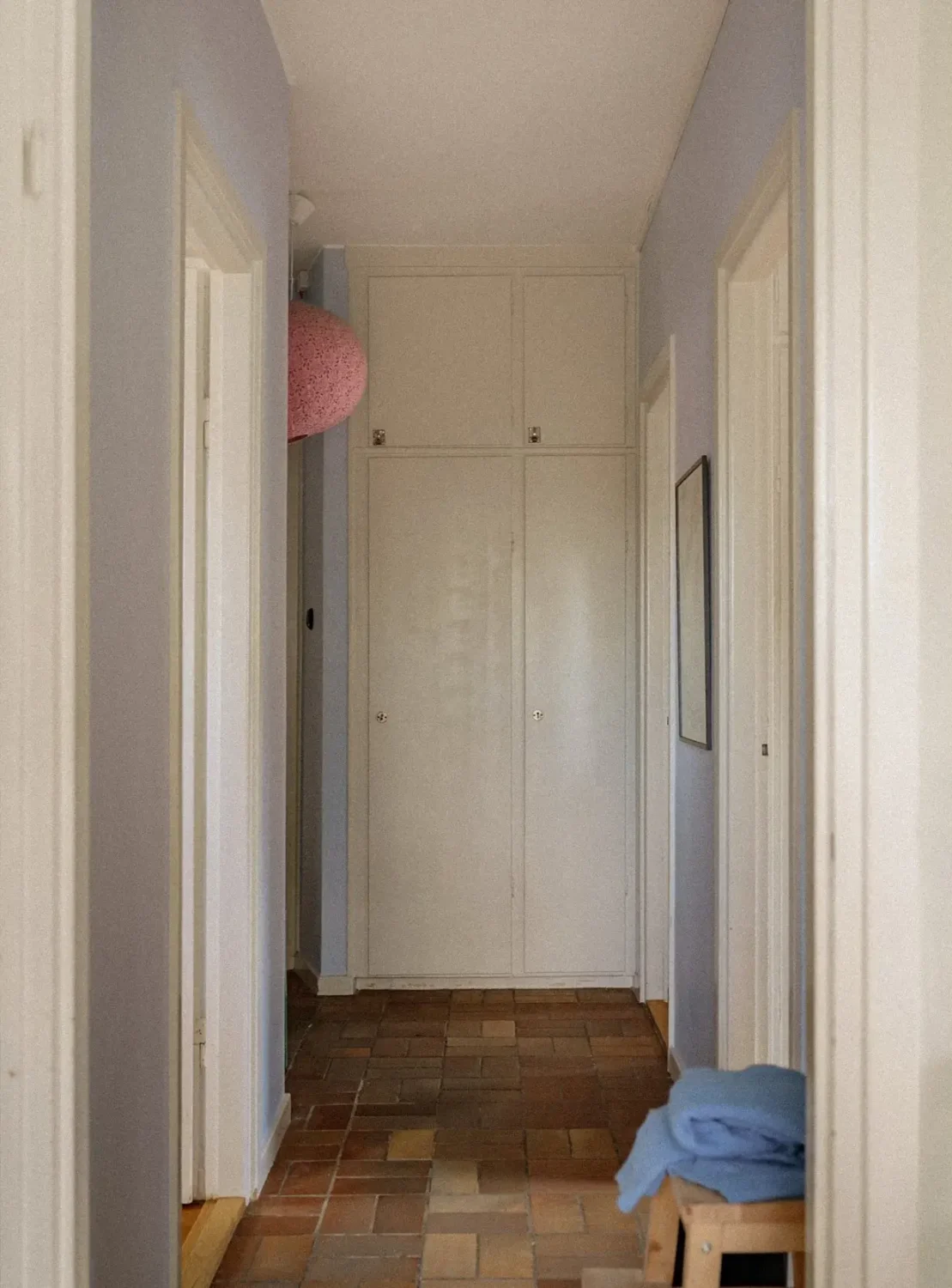 Green Tones and Period Elements in a 1940s Apartment 16 hall stone floor lavender walls built in wardrobes Green Tones and Period Elements in a 1940s Apartment