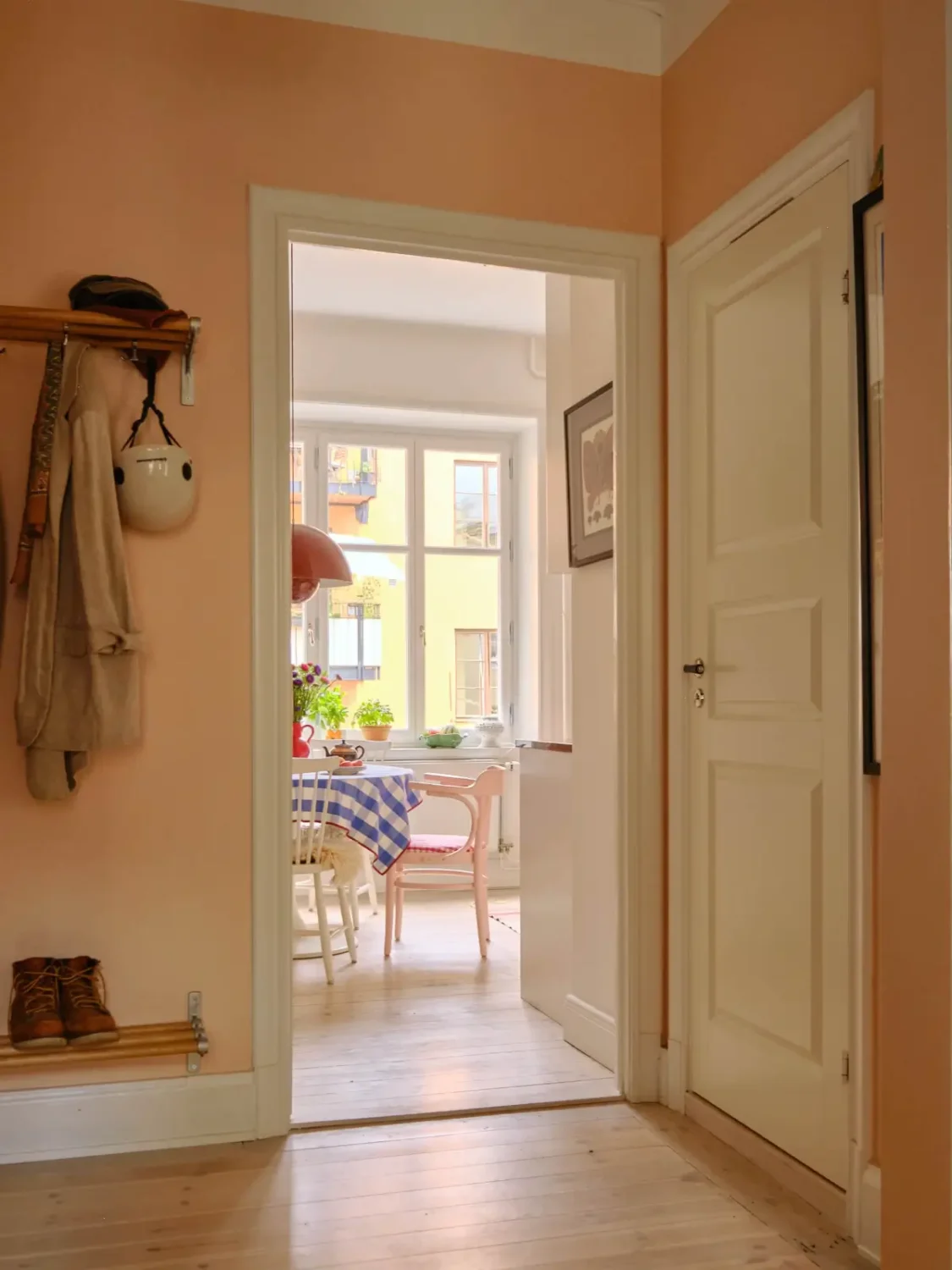 Green and Apricot Rooms in a Charming Stockholm Apartment 13 hall view into kitchen