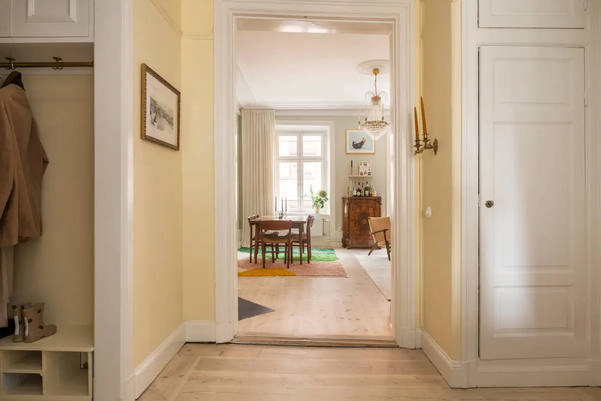 A Stylish Beige Apartment with a Light Blue Kitchen 32 hall view into living room