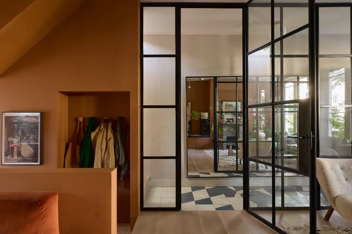 A Beautiful Victorian Townhouse Reimagined for Modern Living 25 industrial glass wall storage niche for coats