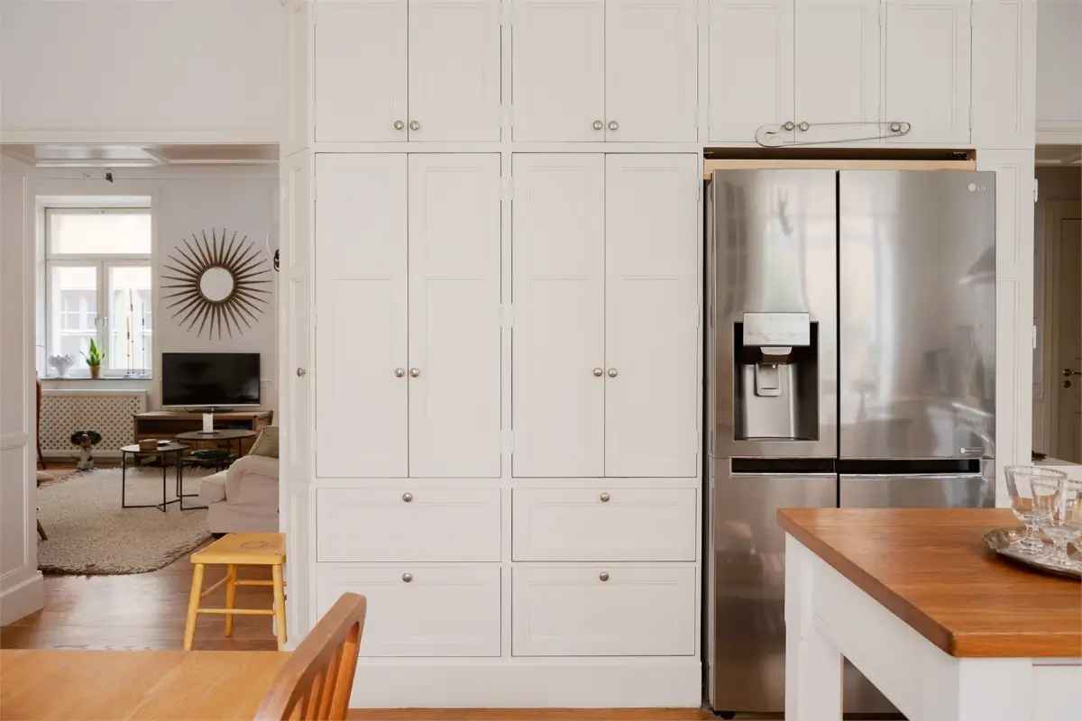 A Light-Filled Stockholm Apartment with a Charming Kitchen 9 kitchen cabinets