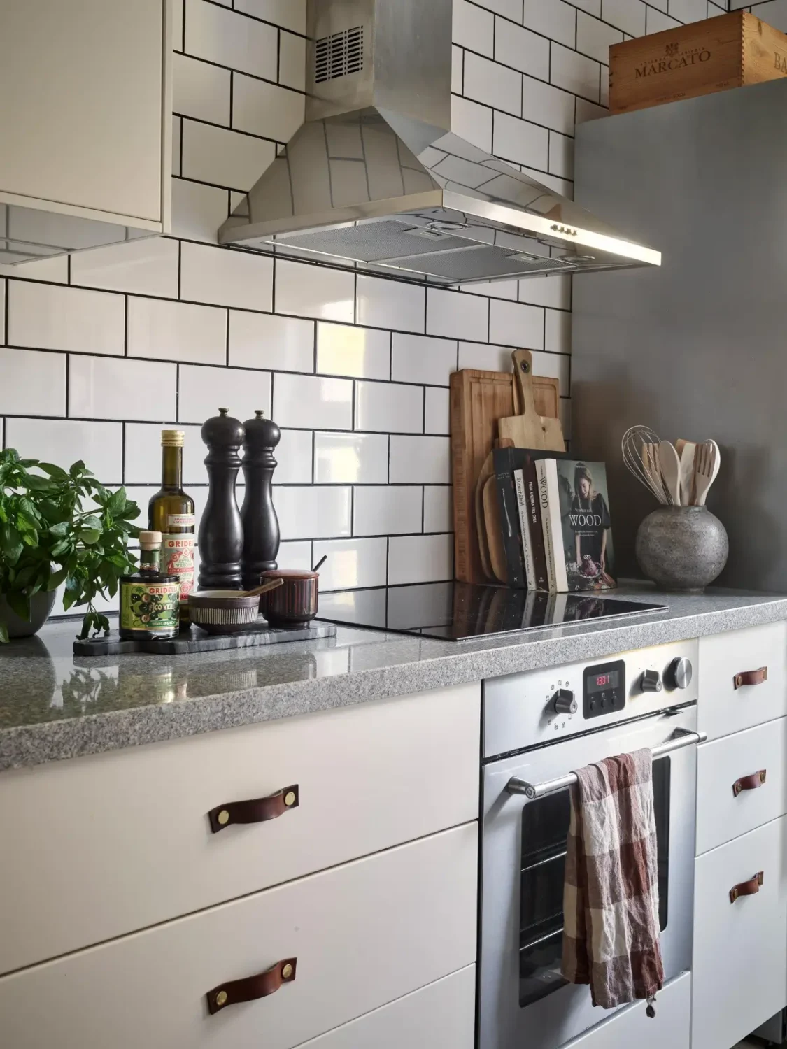 Gray Tones and High Ceilings in a Cozy Swedish Duplex Apartment 31 kitchen detail