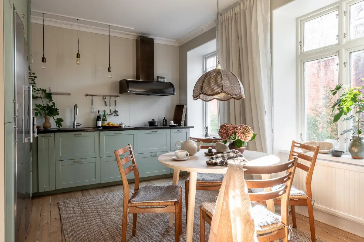 William Morris Wallpapers and Period Features in a Gothenburg Apartment 15 kitchen green cabinets round wooden table