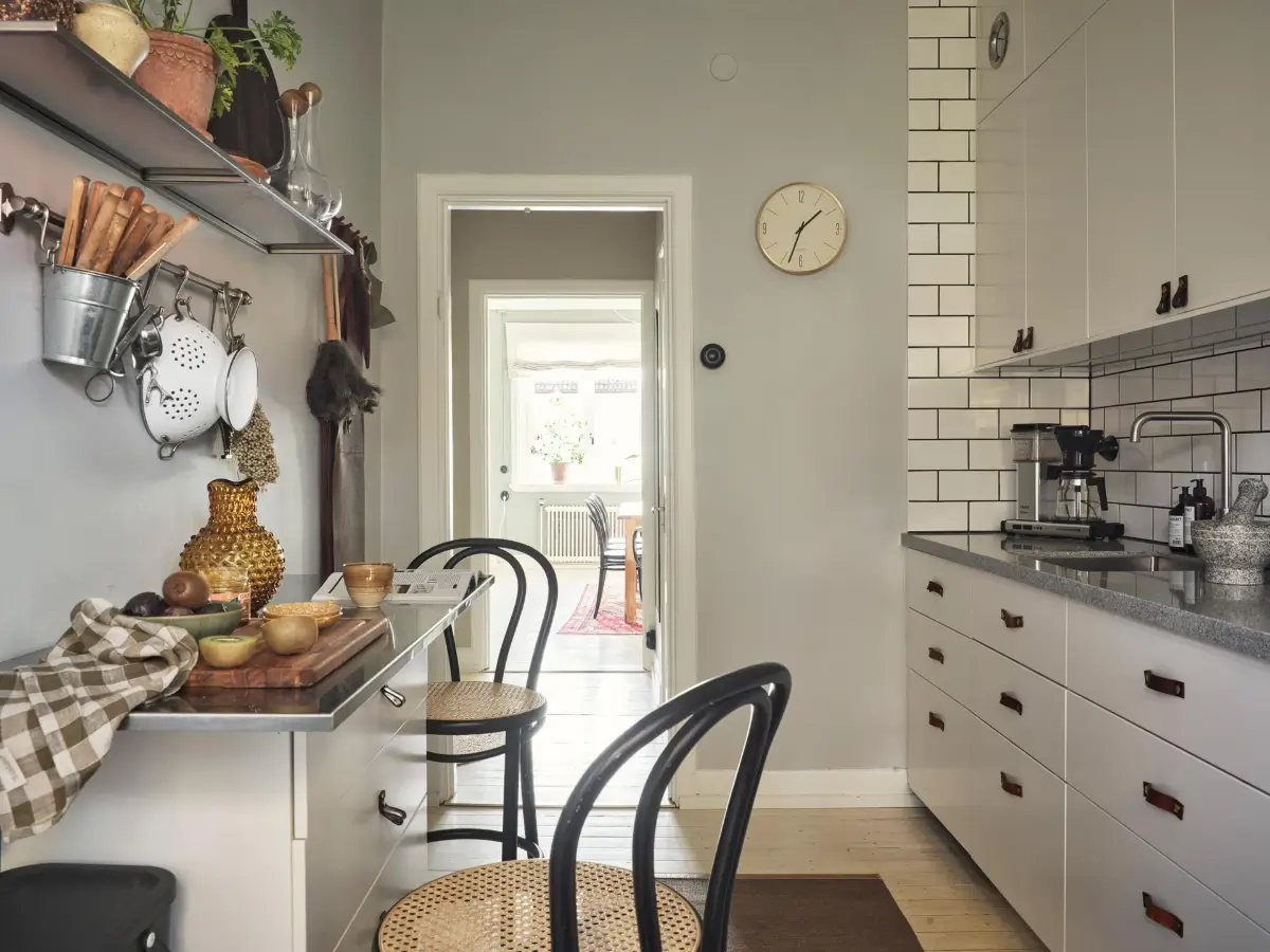 Gray Tones and High Ceilings in a Cozy Swedish Duplex Apartment 33 kitchen light gray walls bar seating