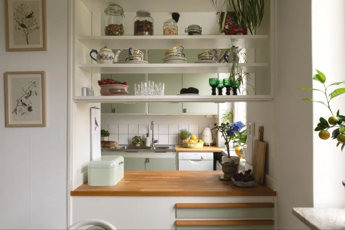 A Well-Preserved 1950s Apartment North of Stockholm 15 kitchen opening to dining room with shelves