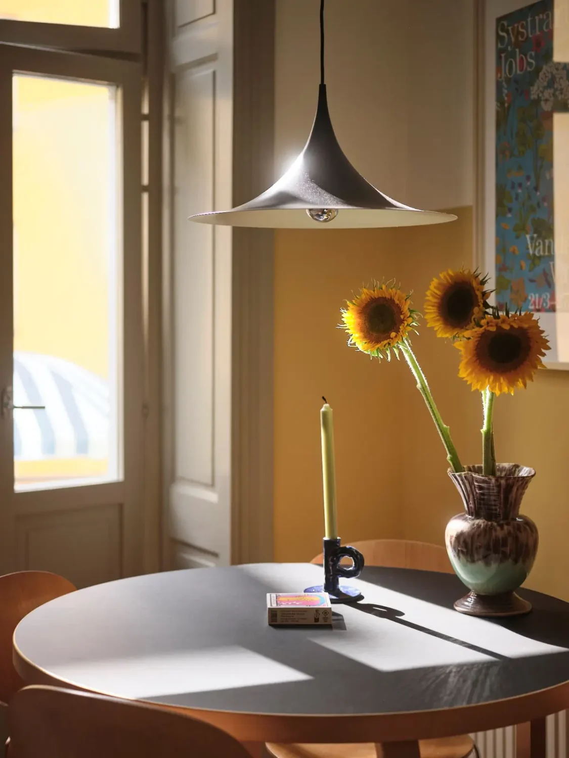 Color, Books, and a Walk-In Wardrobe in a Small Stockholm Apartment 7 kitchen table detail
