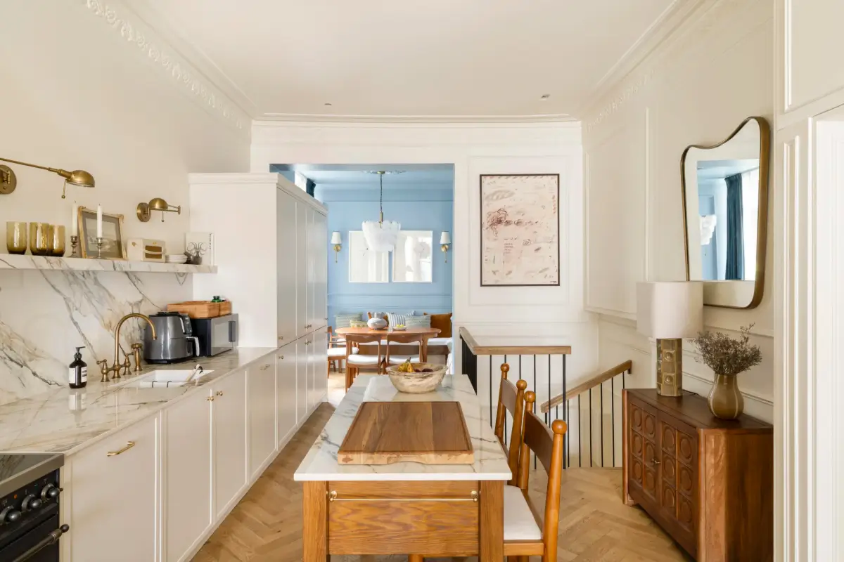 A Notting Hill Duplex Pairs Art and Victorian Architecture 7 kitchen-with-island-marble-countertop