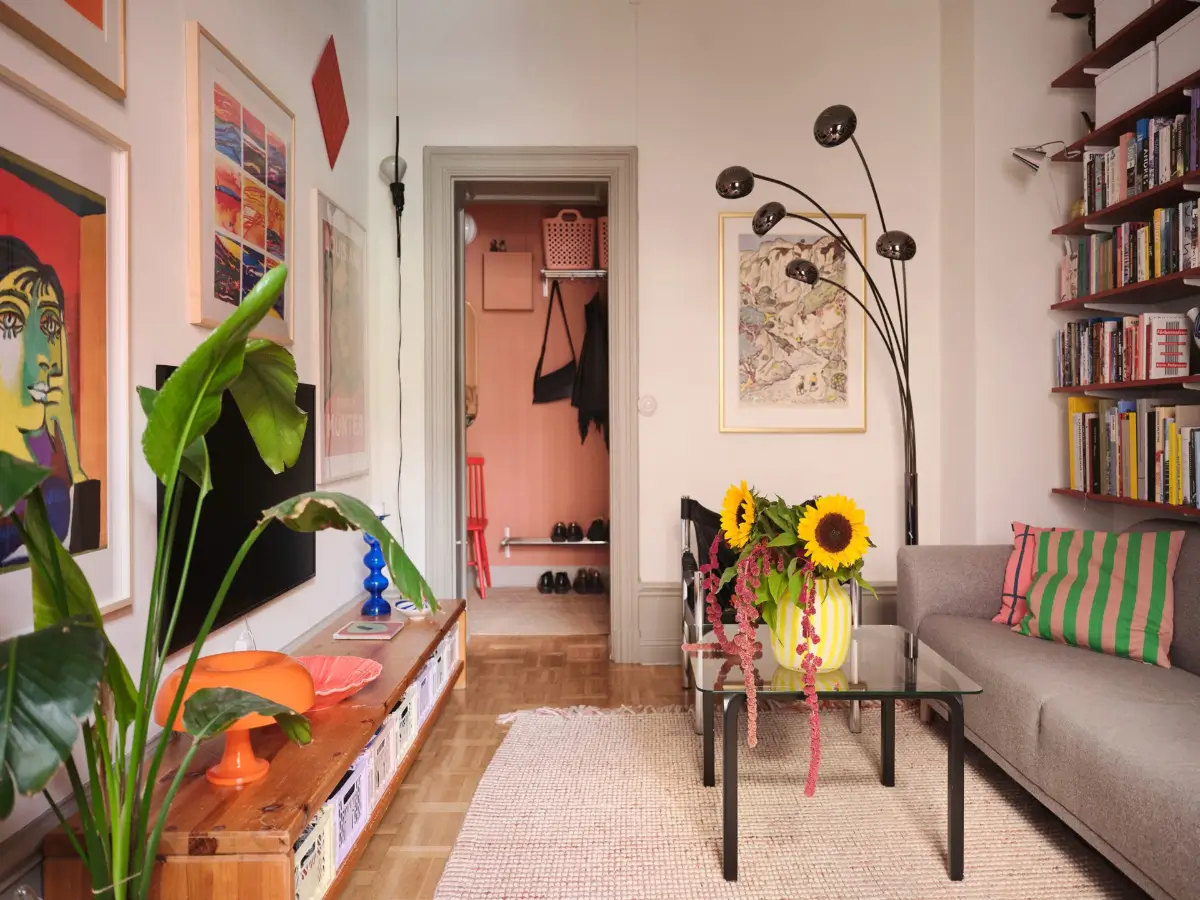 Color, Books, and a Walk-In Wardrobe in a Small Stockholm Apartment 17 living room bookshelves parquet floor