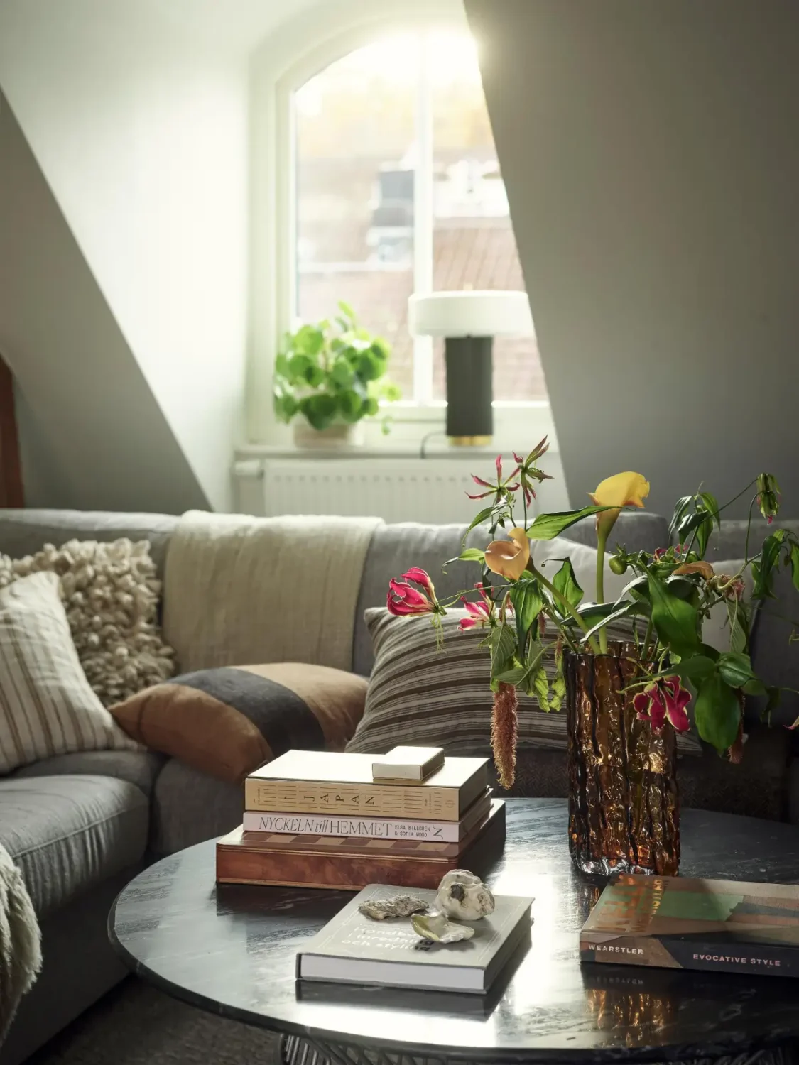 Gray Tones and High Ceilings in a Cozy Swedish Duplex Apartment 5 living room detail